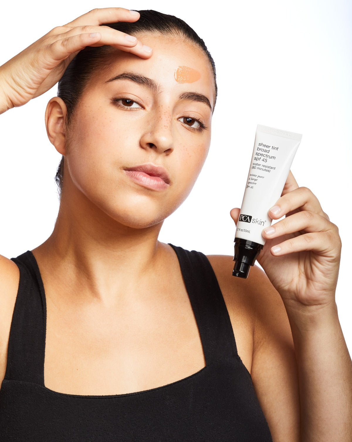 PCA Skin Sheer Tint Broad Spectrum SPF 45 50ml being applied