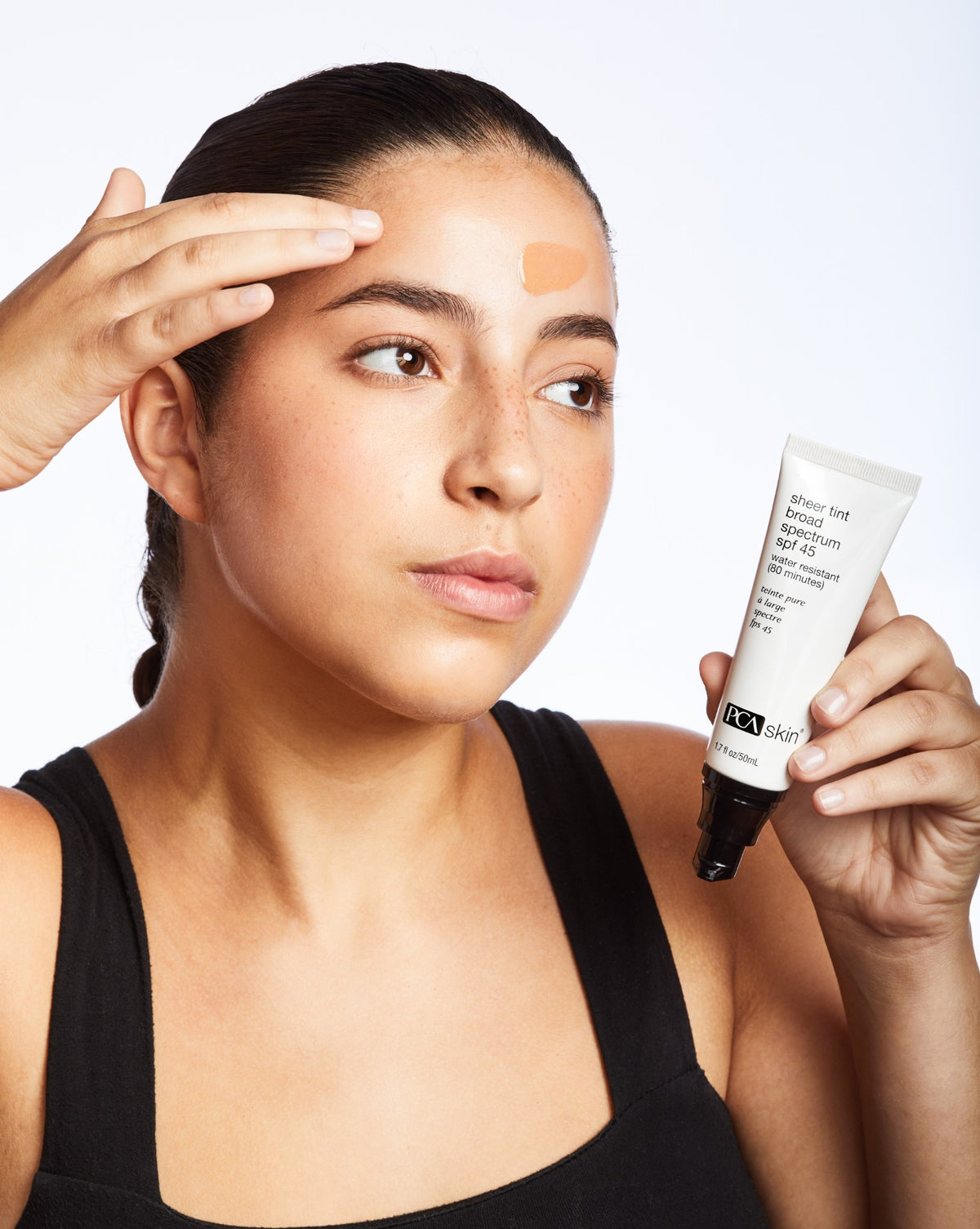 PCA Skin Sheer Tint Broad Spectrum SPF 45 50ml being applied